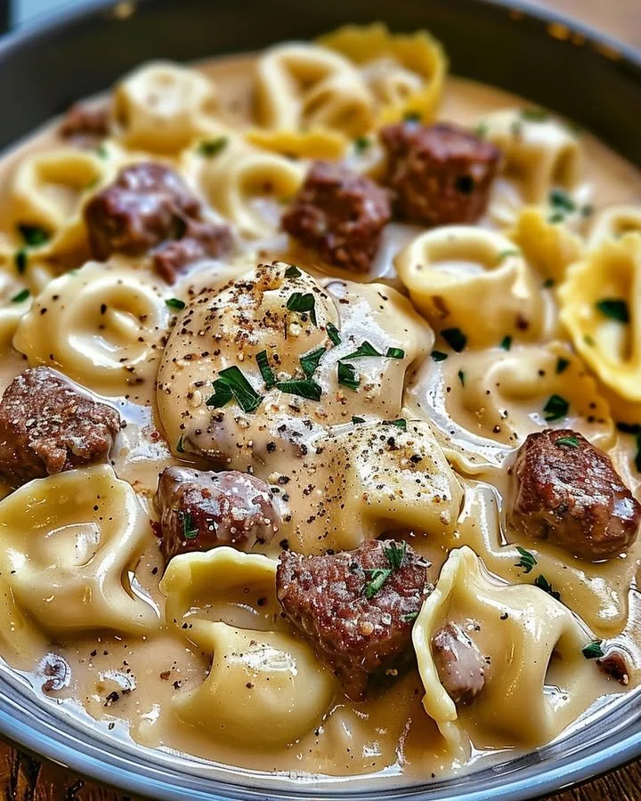 Cheesesteak Tortellini served in a creamy provolone sauce