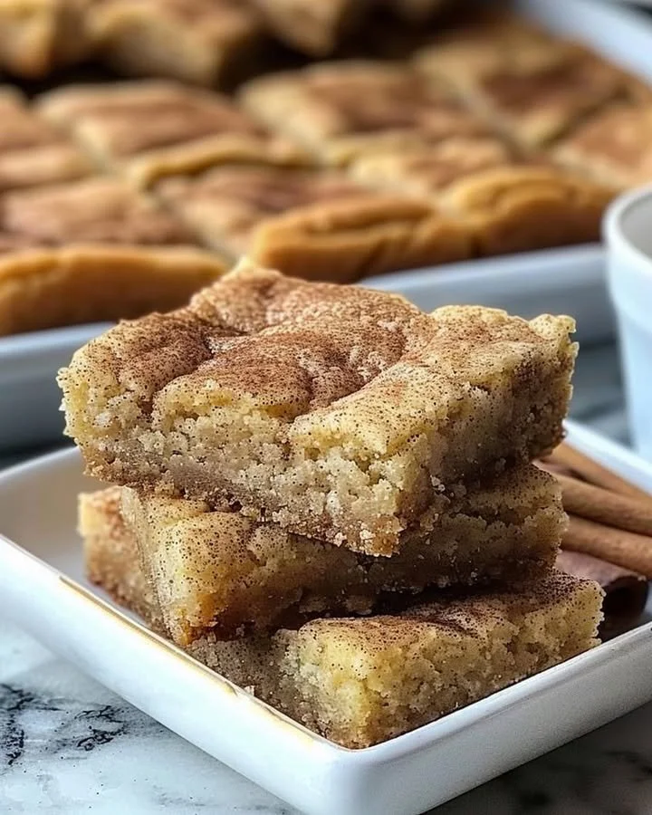 Delicious chewy snickerdoodle cookie bars topped with cinnamon sugar