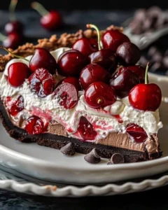 Chocolate Cherry Cream Pie topped with cherries and chocolate shavings