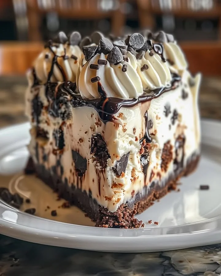 Decadent chocolate chip cookie dough ice cream cake with layers of creamy goodness