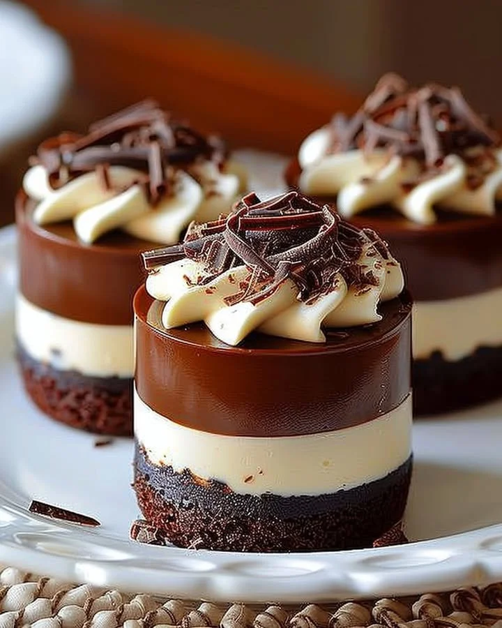 Delicious Chocolate Royale Mini Cakes topped with chocolate icing and decorations.
