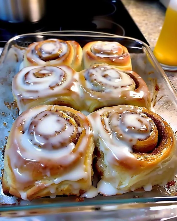 Freshly baked classic cinnamon rolls with icing on top