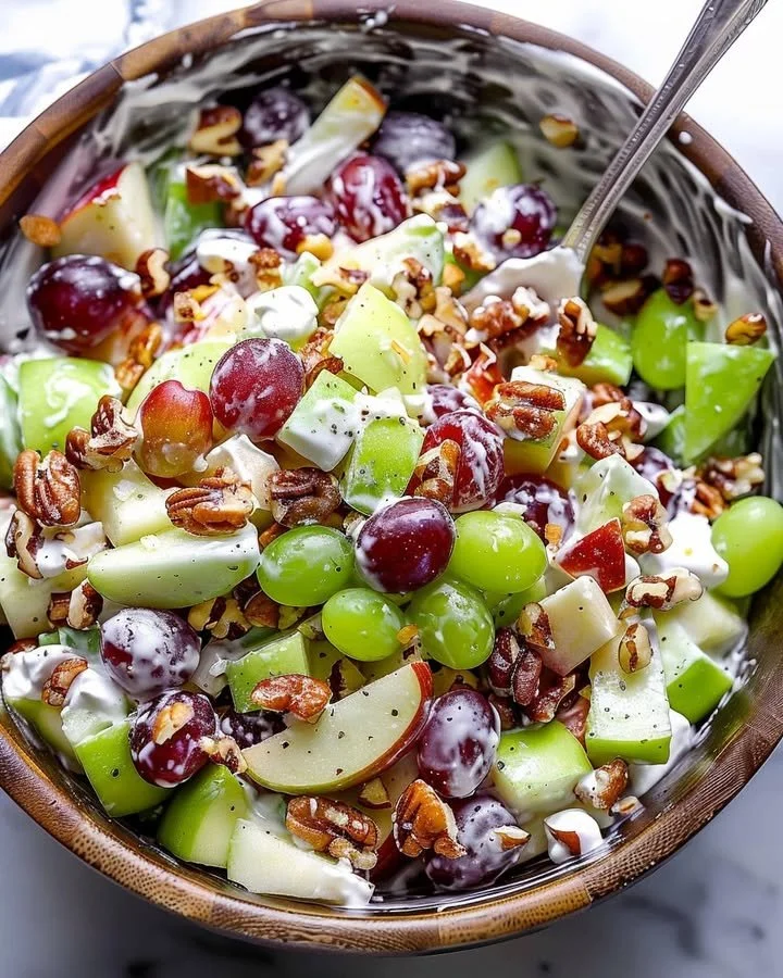 Classic Waldorf salad with apples, walnuts, and celery served in a bowl