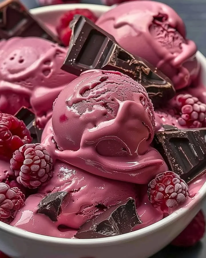 A bowl of delicious Crimson Cocoa Rhapsody Ice Cream topped with chocolate shavings.