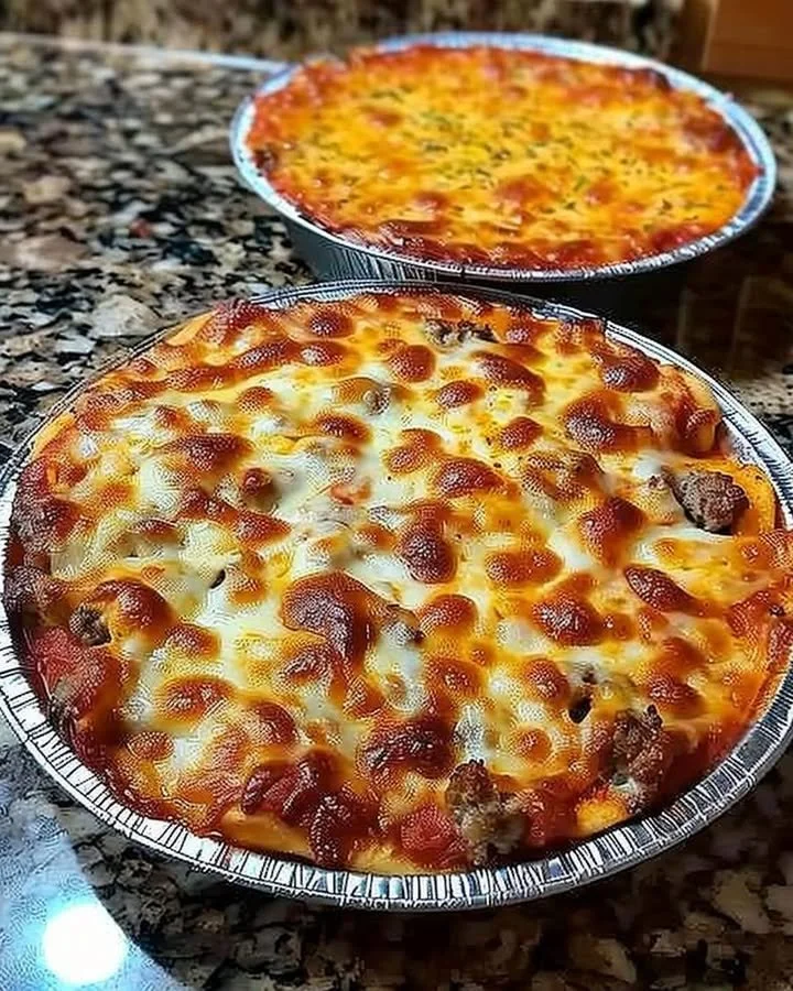 Delicious crustless pizza bowl topped with fresh ingredients and cheese.