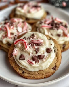 Frosted peppermint chocolate chunk cookies with festive sprinkles