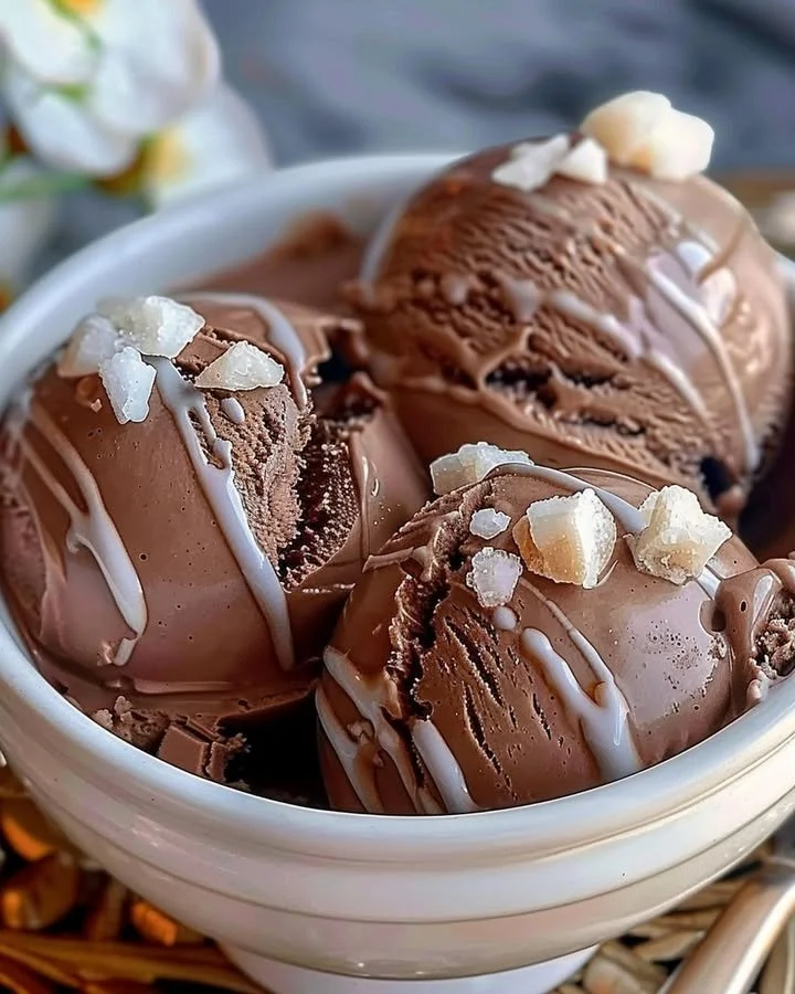 Bowl of creamy homemade chocolate ice cream with chocolate shavings