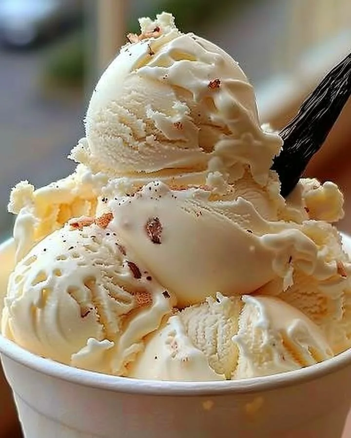 Bowl of homemade vanilla ice cream with toppings