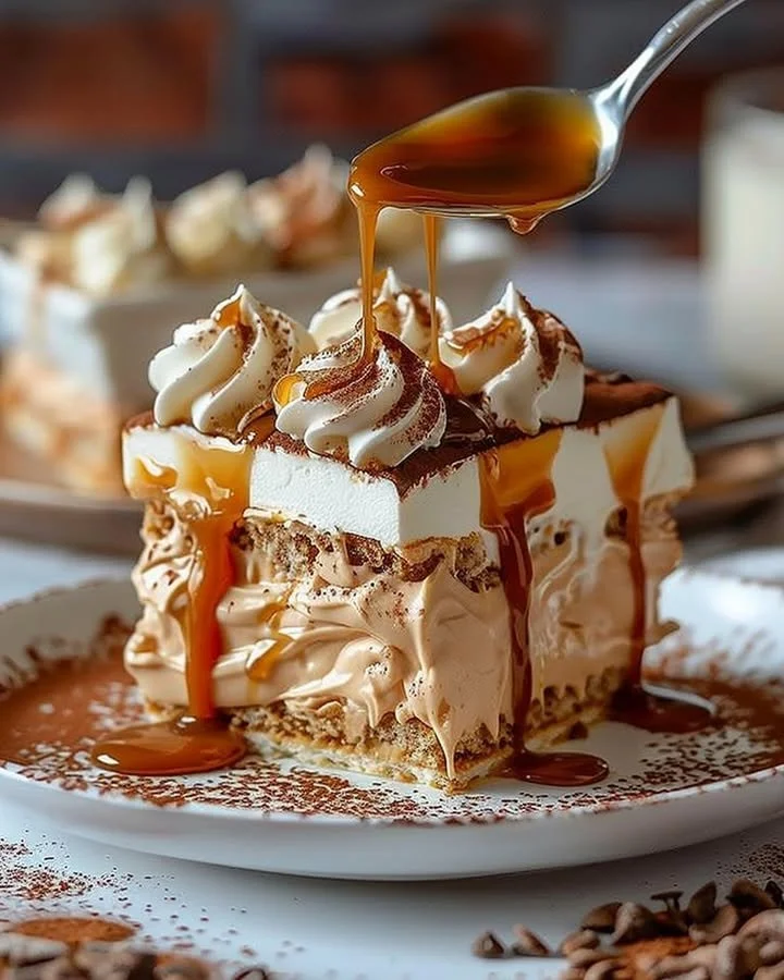 Delicious Milk Caramel Tiramisu dessert in a glass with layers of cream and caramel.