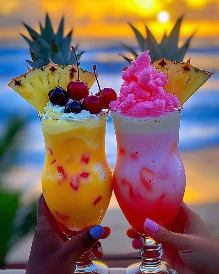 Colorful Rainbow Sherbet Piña Colada in a glass with tropical fruits.