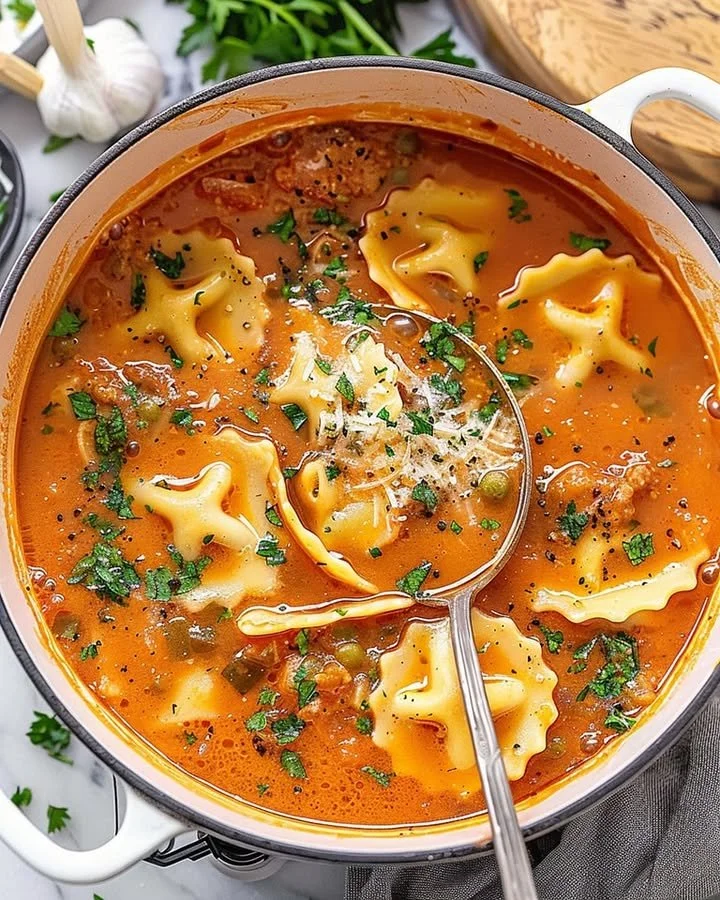 One pot ravioli soup with fresh herbs and vegetables