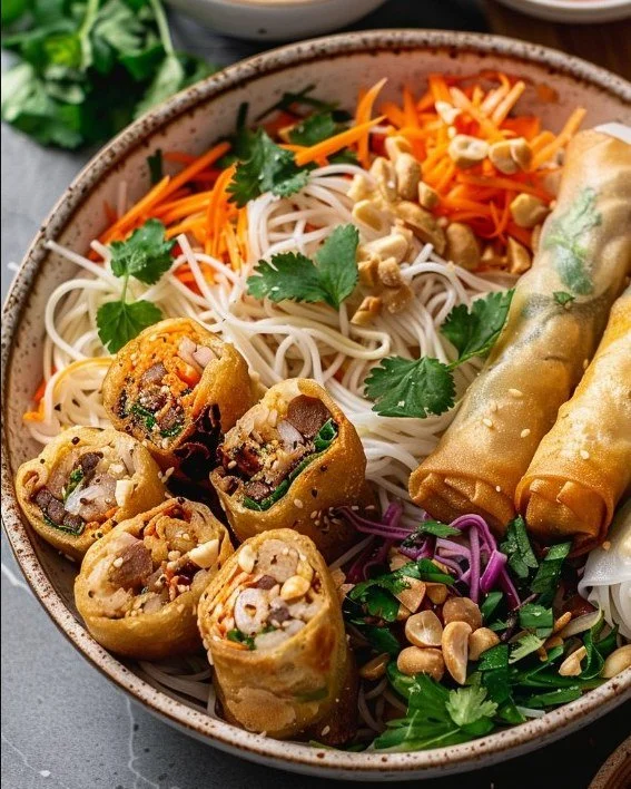 Delicious Thai Peanut Spring Roll Noodle Bowl with fresh vegetables and toppings